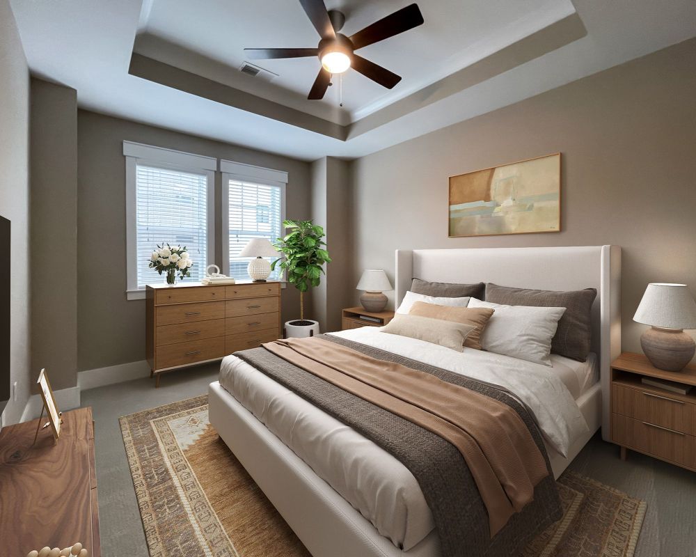 The Village at Commonwealth penthouse spacious bedroom with high ceilings and modern furnishings